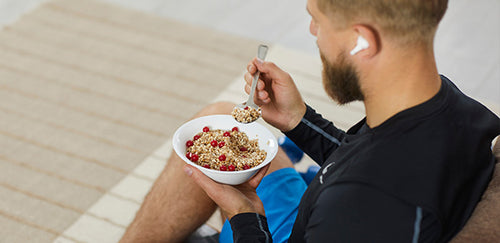 image of athlete eating oatmeal and berries